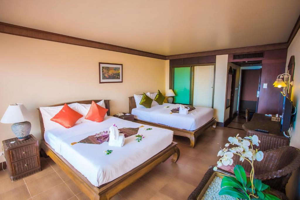 Postel nebo postele na pokoji v ubytování Samui Bayview Resort & Spa - SHA Plus