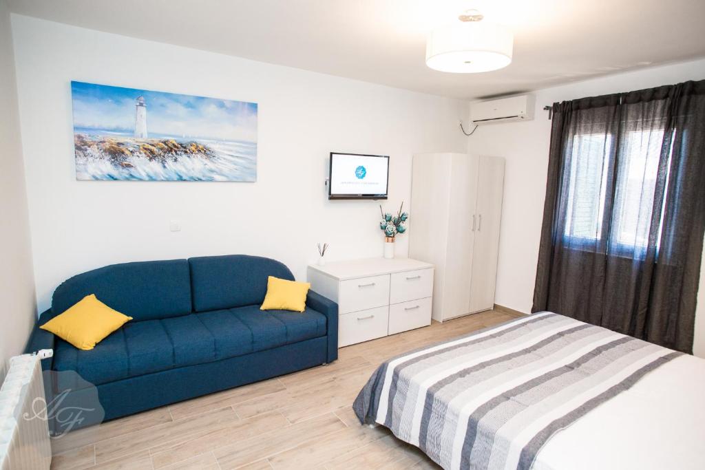 Posteľ alebo postele v izbe v ubytovaní Apartmani Ferdinanda