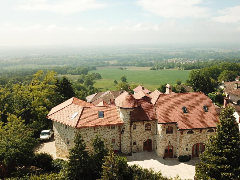 an aerial view of a large stone house with red roofs at Les Lumières de Genève in Grilly