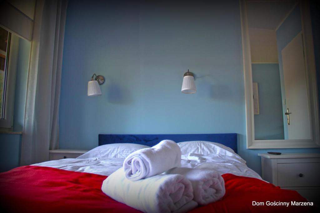 Postel nebo postele na pokoji v ubytování Dom Gościnny Marzena