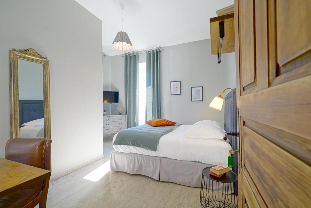 Postel nebo postele na pokoji v ubytování Hôtel U Frascone