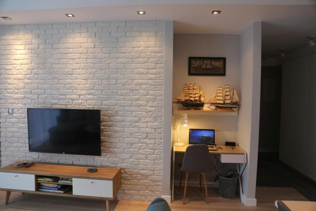Televízia a/alebo spoločenská miestnosť v ubytovaní ASKI New Powiśle Copernicus Apartment