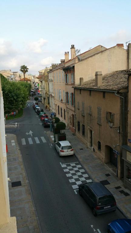 a street with cars parked on the side of the road at le mauritania in Sainte-Maxime