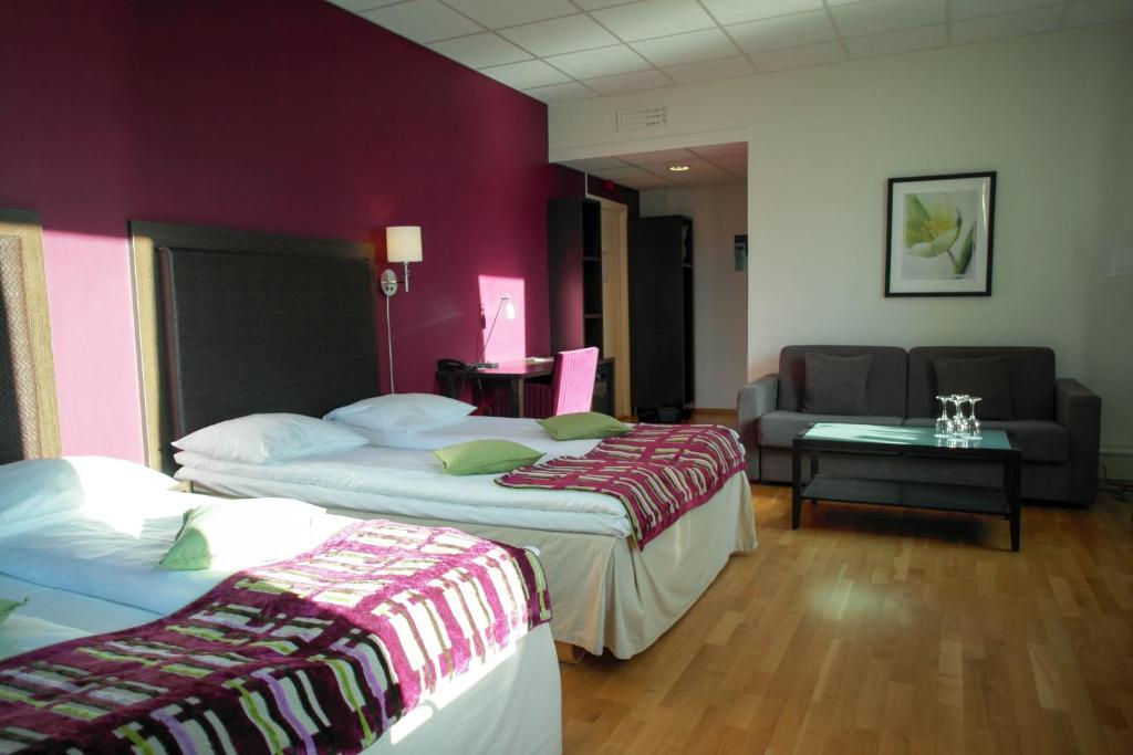 Postel nebo postele na pokoji v ubytování Quality Hotel Augustin