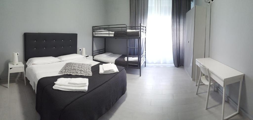 Postel nebo postele na pokoji v ubytování Hotel Milano