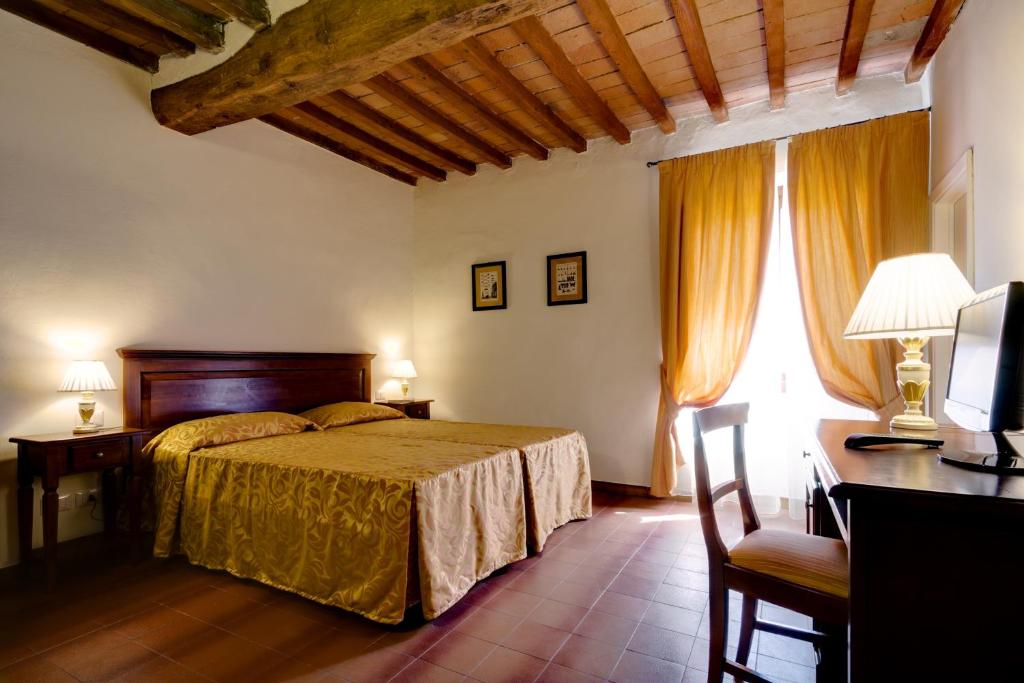 Postel nebo postele na pokoji v ubytování Hotel Il Cavallo
