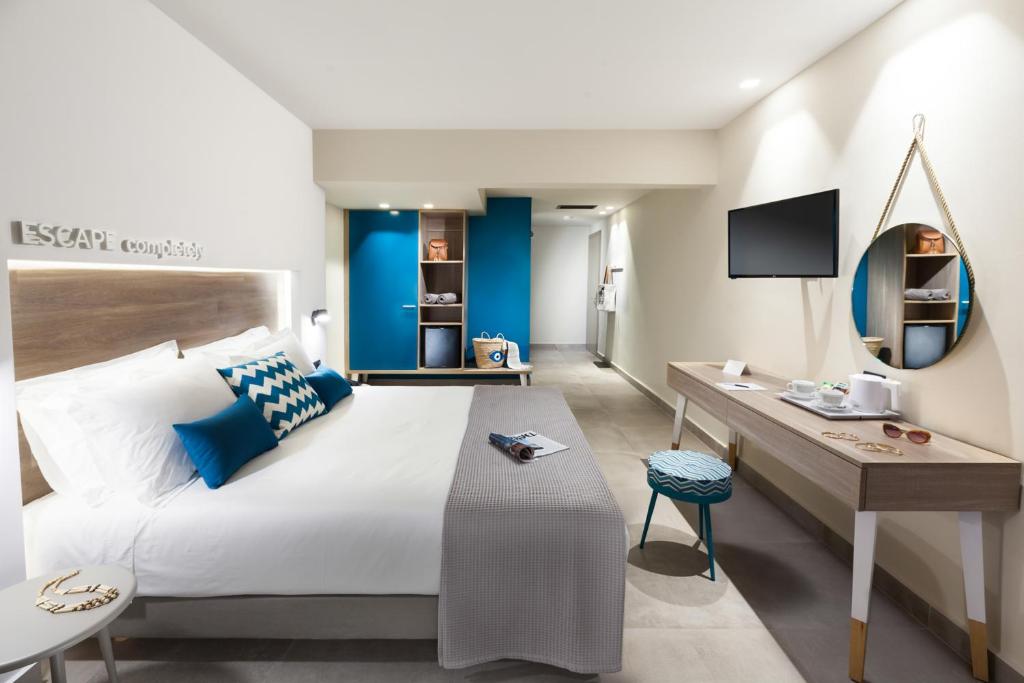 A bed or beds in a room at Carian Hotel