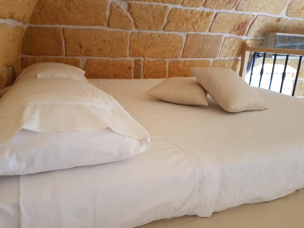 Postel nebo postele na pokoji v ubytování Dimora La Nicchia