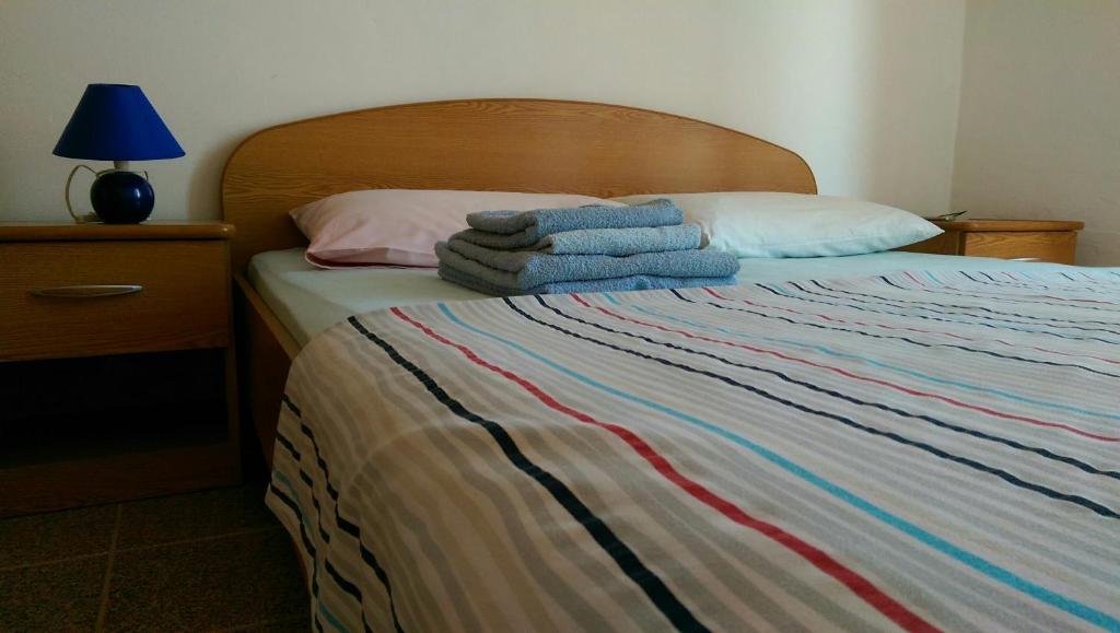 Postel nebo postele na pokoji v ubytování Apartman Knezevic