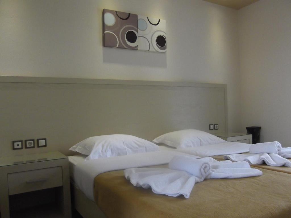 Postel nebo postele na pokoji v ubytování Mariana Hotel