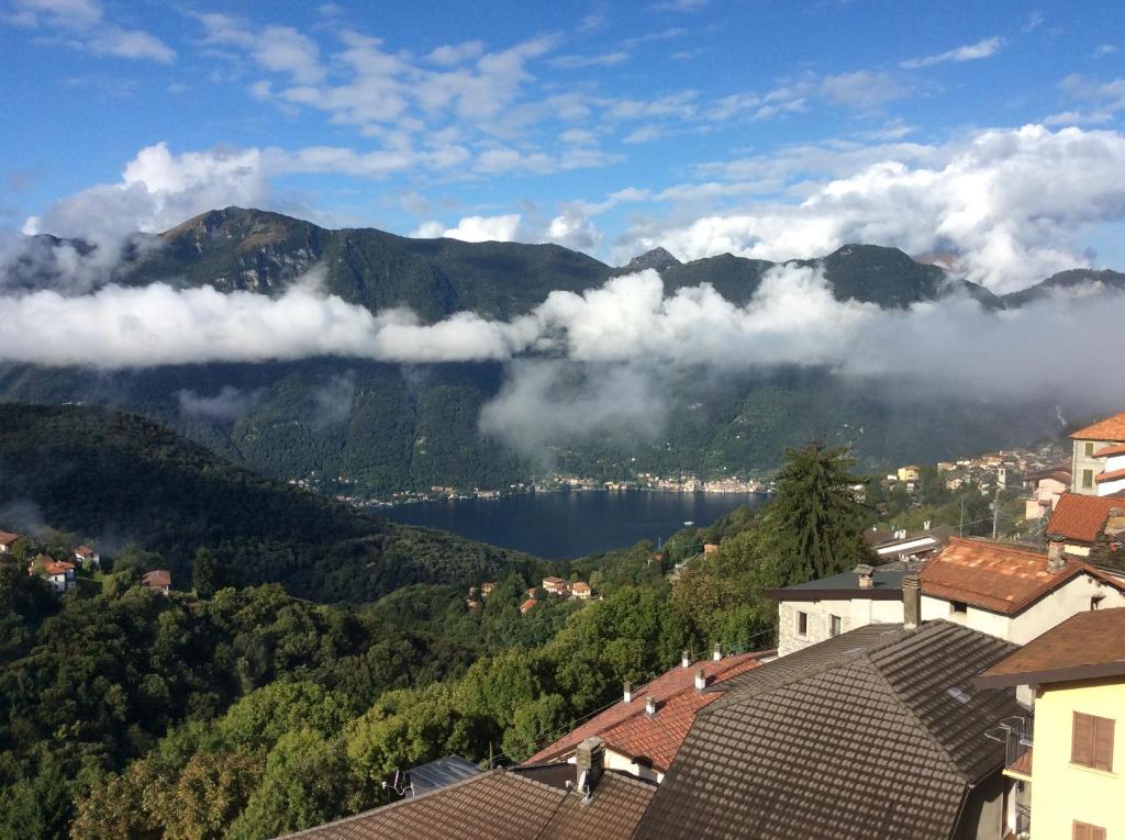a town with a view of a lake and mountains at Cadorna Chalet in Veleso