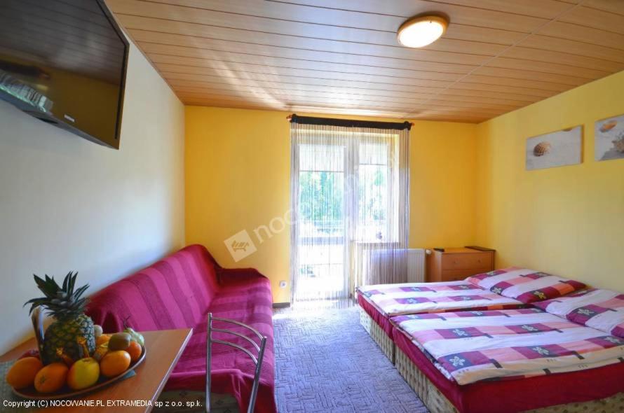 Łóżko lub łóżka w pokoju w obiekcie Villa Orchidea