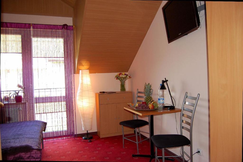 Telewizja i/lub zestaw kina domowego w obiekcie Villa Orchidea