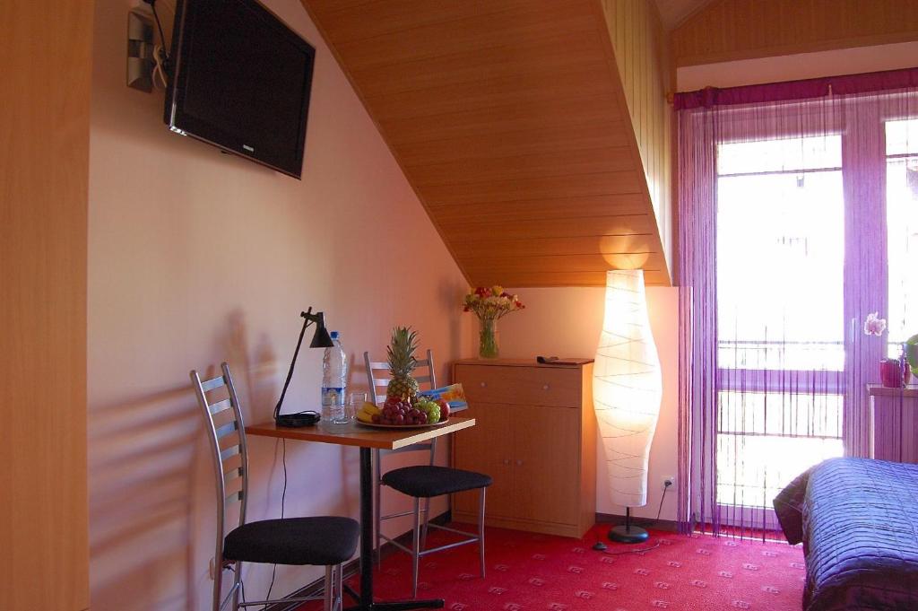Telewizja i/lub zestaw kina domowego w obiekcie Villa Orchidea