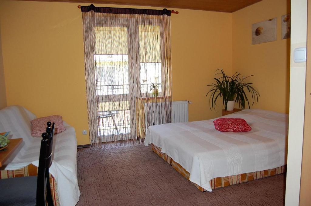 Łóżko lub łóżka w pokoju w obiekcie Villa Orchidea