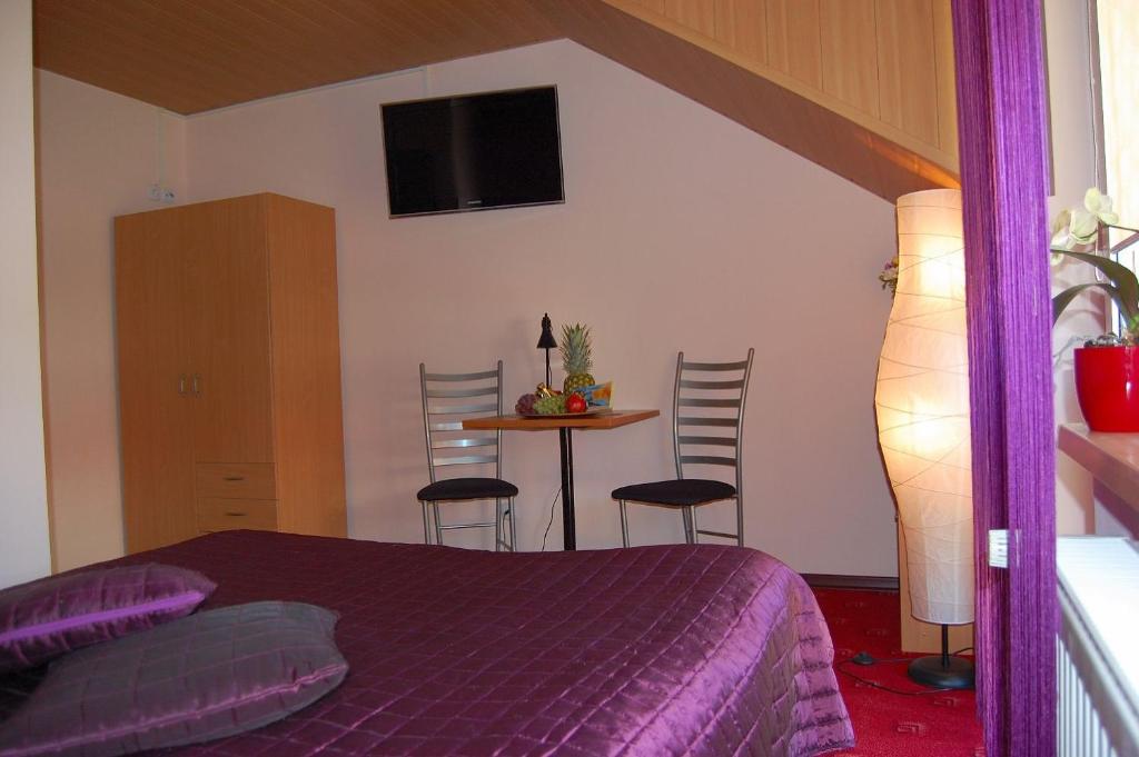 Łóżko lub łóżka w pokoju w obiekcie Villa Orchidea