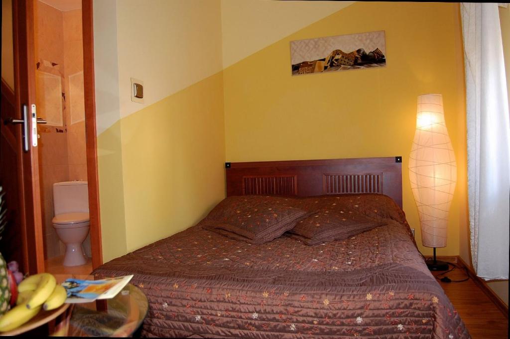 Łóżko lub łóżka w pokoju w obiekcie Villa Orchidea