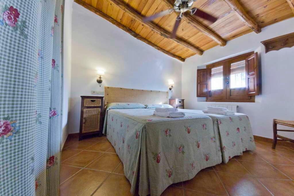 Cama o camas de una habitación en Cortijo Balzain