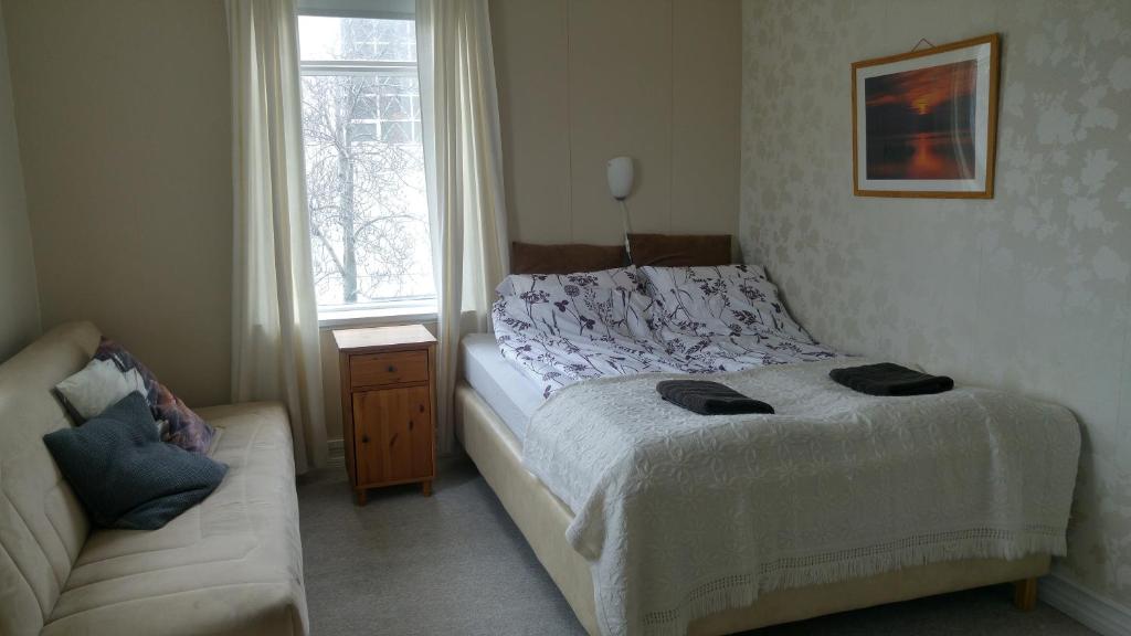 Postel nebo postele na pokoji v ubytování Guesthouse Sólgardar