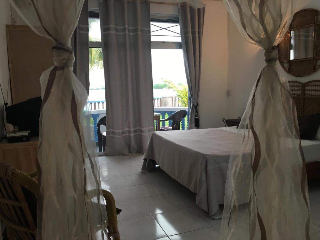 Postel nebo postele na pokoji v ubytování Coco Villa