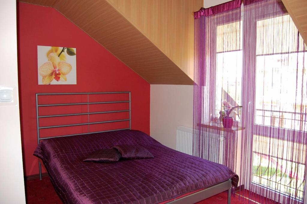 Łóżko lub łóżka w pokoju w obiekcie Villa Orchidea