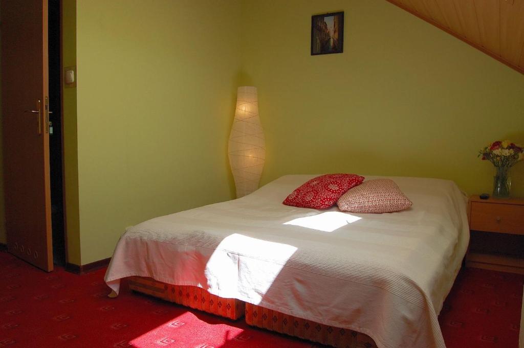 Łóżko lub łóżka w pokoju w obiekcie Villa Orchidea