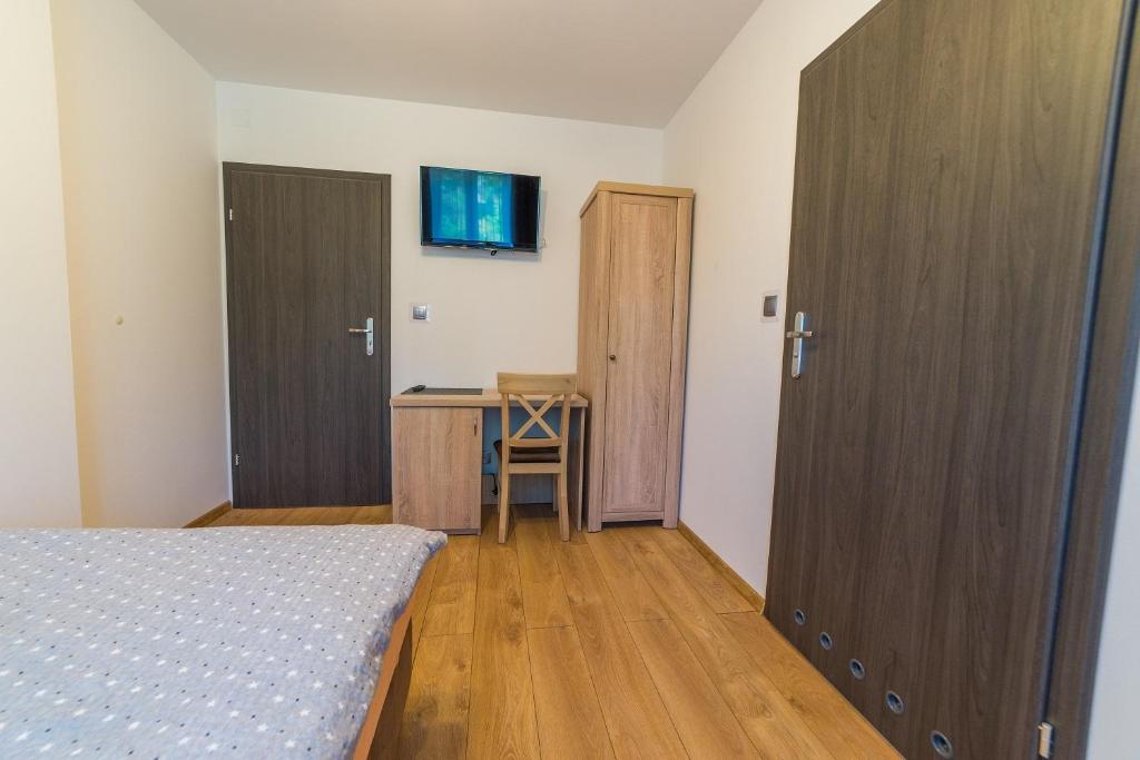 Posteľ alebo postele v izbe v ubytovaní Villa Mikołajki Popiełuszki 8