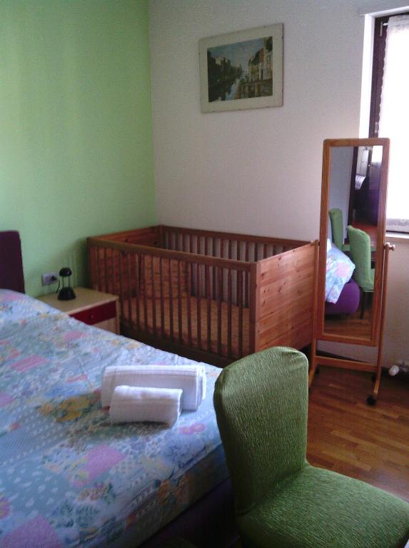 A bed or beds in a room at Donatella Apartment
