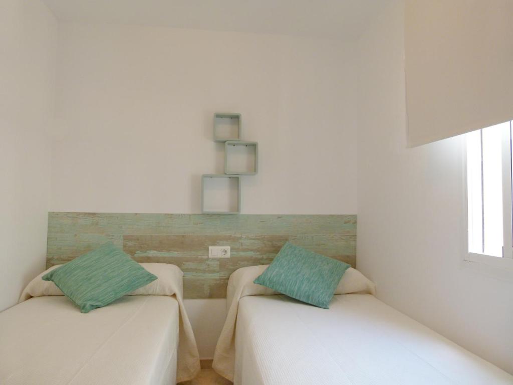 Łóżko lub łóżka w pokoju w obiekcie Casa Volare- estilo y relax en pleno casco antiguo