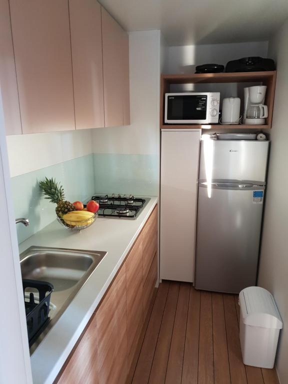 Kuchyň nebo kuchyňský kout v ubytování Mobile Home Starfish I Camp Biograd