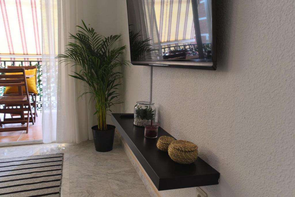 Televízia a/alebo spoločenská miestnosť v ubytovaní Homely Málaga Don Cristian con Parking privado