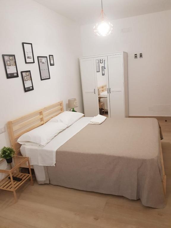 Postel nebo postele na pokoji v ubytování Hercules House - Il riposo degli Eroi