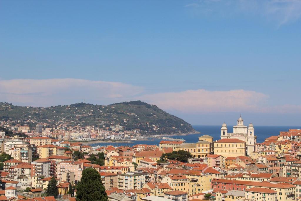 a view of a city with buildings and the ocean at La conchiglia vista mare in Imperia