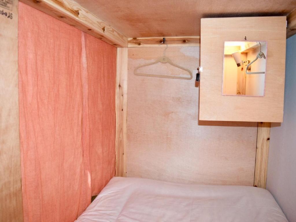 Postel nebo postele na pokoji v ubytování Hiroshima Hostel EN