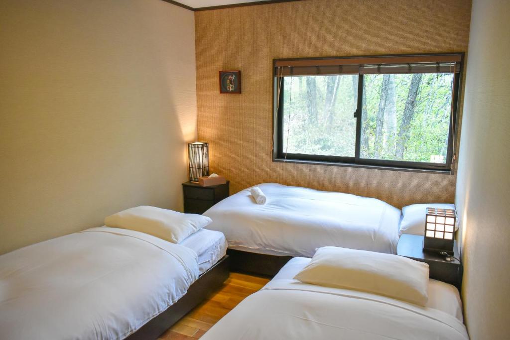 Postel nebo postele na pokoji v ubytování Penke Panke Lodge and Apartments
