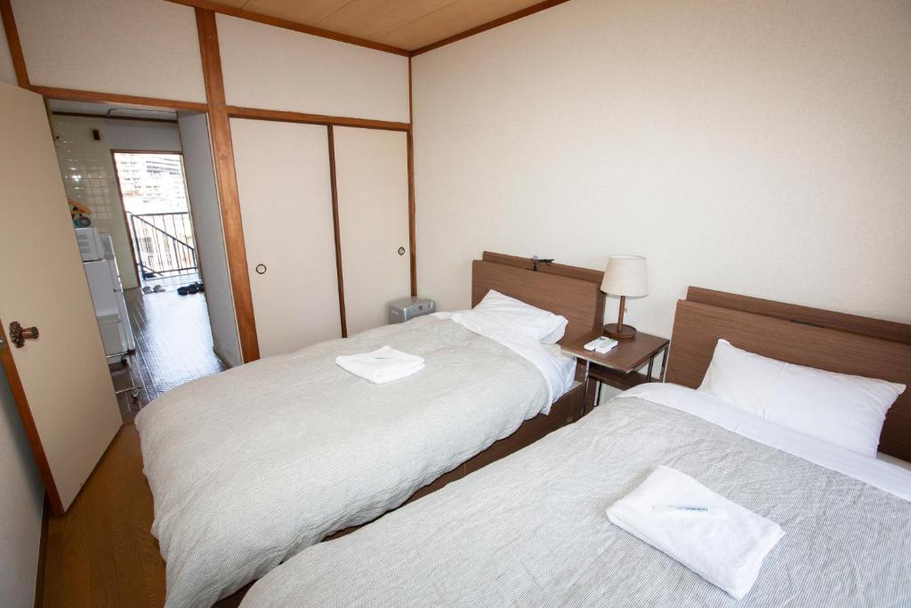Postel nebo postele na pokoji v ubytování Lazy House