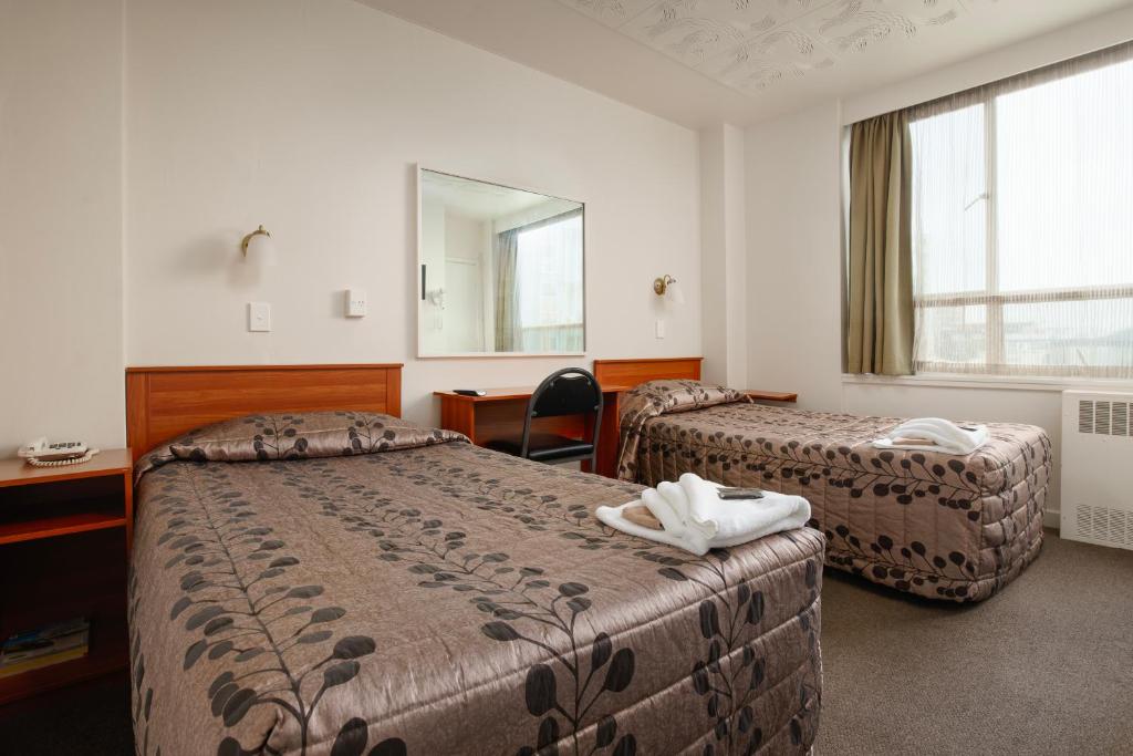 Cama ou camas em um quarto em Kiwi International Hotel