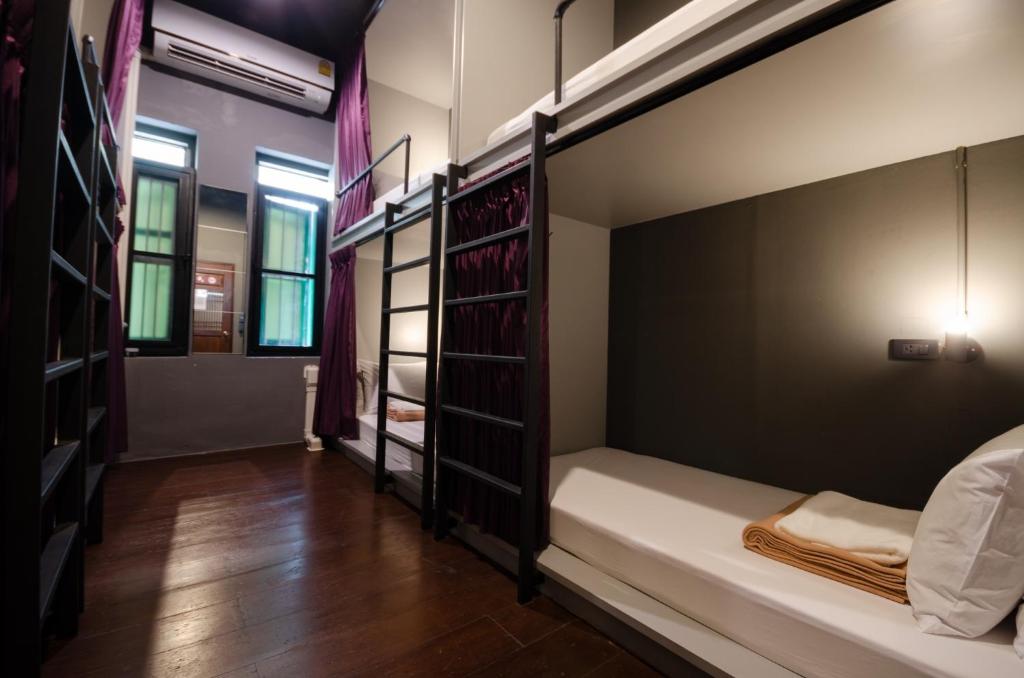Giường trong phòng chung tại Tian Tian Hostel