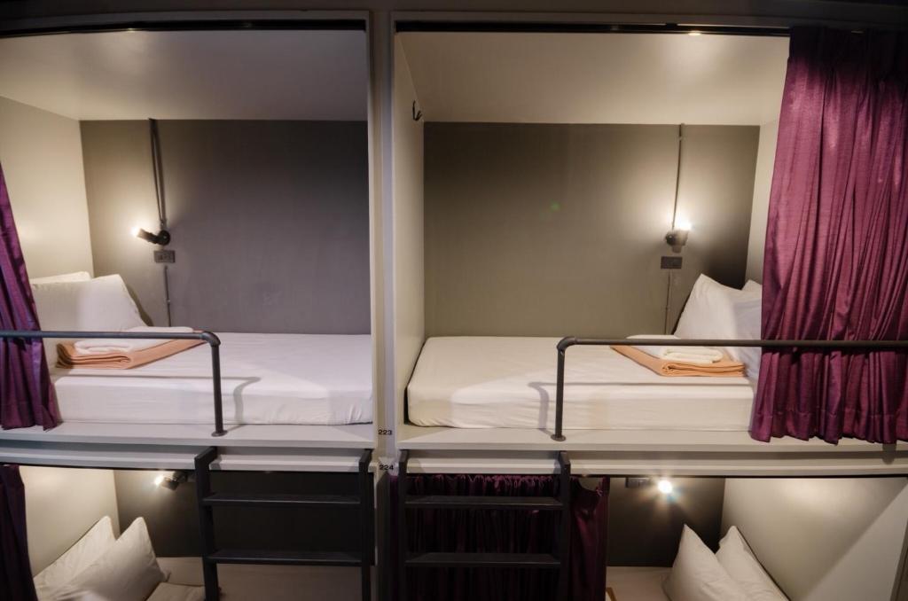 Giường trong phòng chung tại Tian Tian Hostel