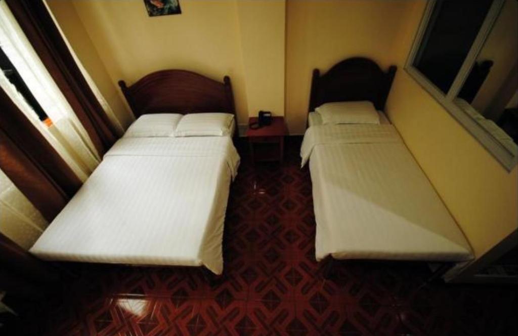 Postel nebo postele na pokoji v ubytování Hotel 45 Extension