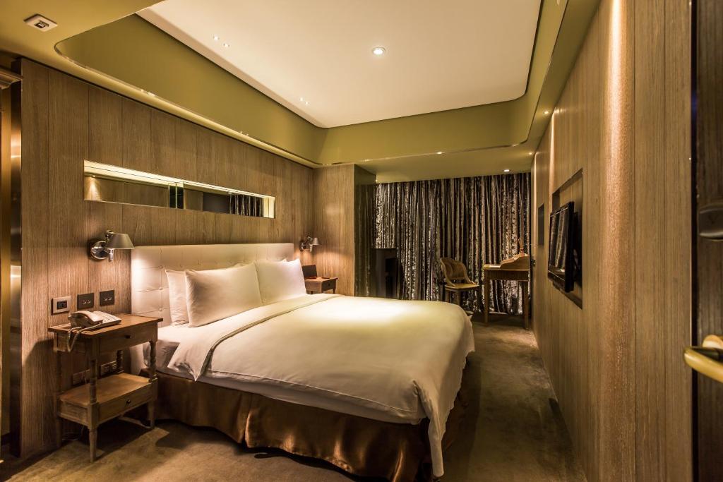 Postel nebo postele na pokoji v ubytování inhouse Hotel