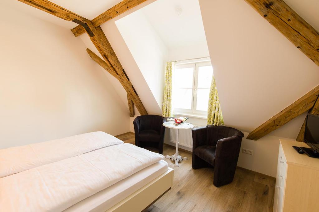 Postel nebo postele na pokoji v ubytování Hotel Garni Viktoria
