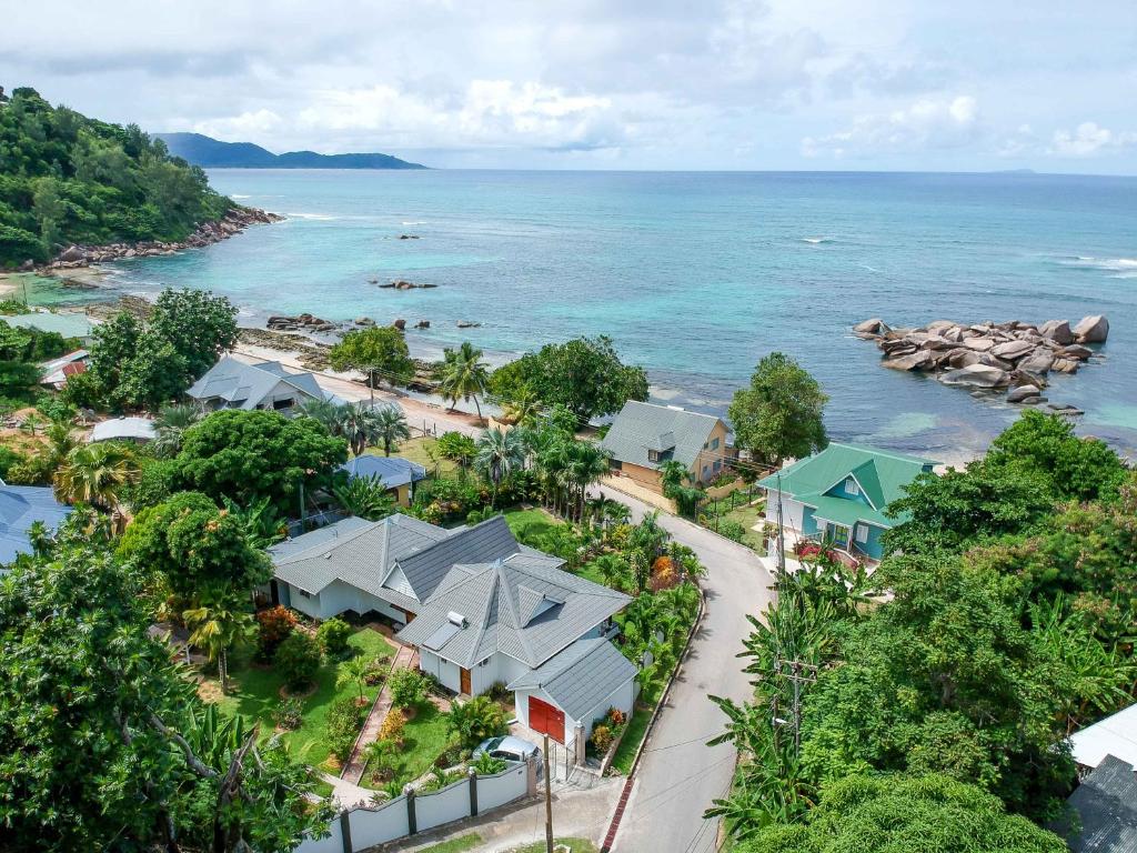 an aerial view of a resort next to the ocean at Nid'Aigle Lodge in Anse Possession