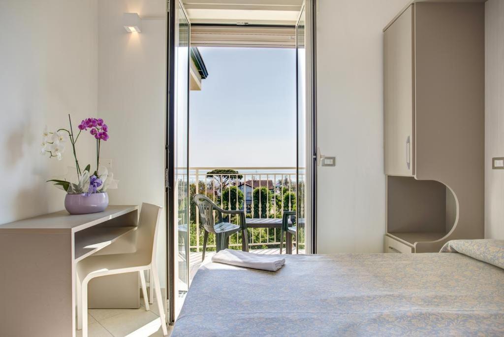 Posteľ alebo postele v izbe v ubytovaní Hotel Amedea