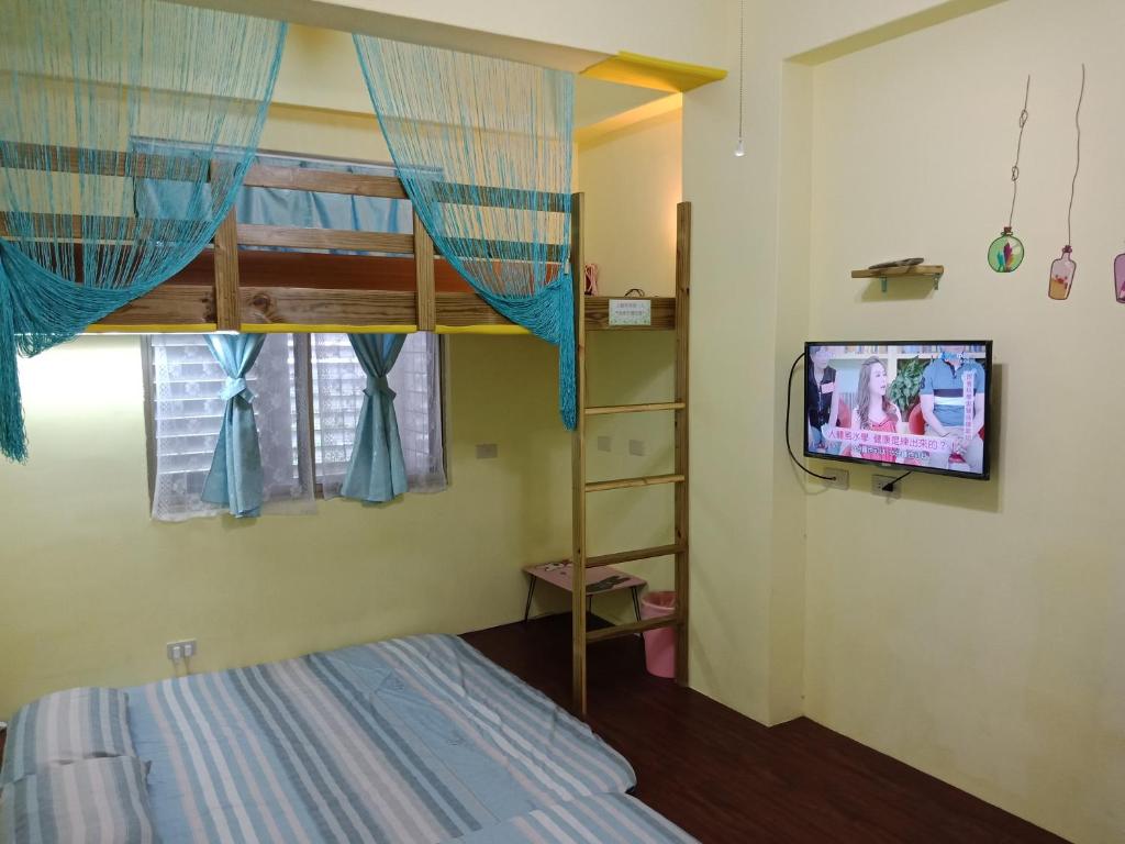Postel nebo postele na pokoji v ubytování Ludao B&B