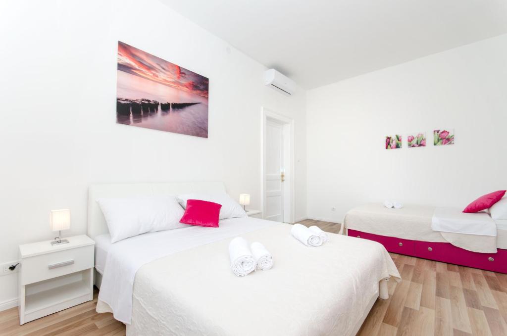 Posteľ alebo postele v izbe v ubytovaní City Core Apartment