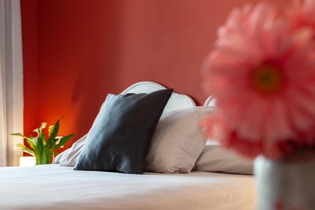 Postel nebo postele na pokoji v ubytování Hotel Maximilian