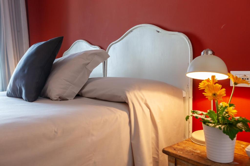 Postel nebo postele na pokoji v ubytování Hotel Maximilian