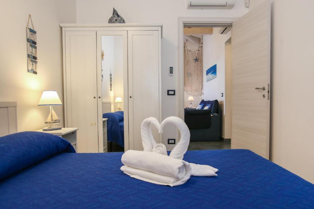 Posteľ alebo postele v izbe v ubytovaní Villa Salina fronte mare