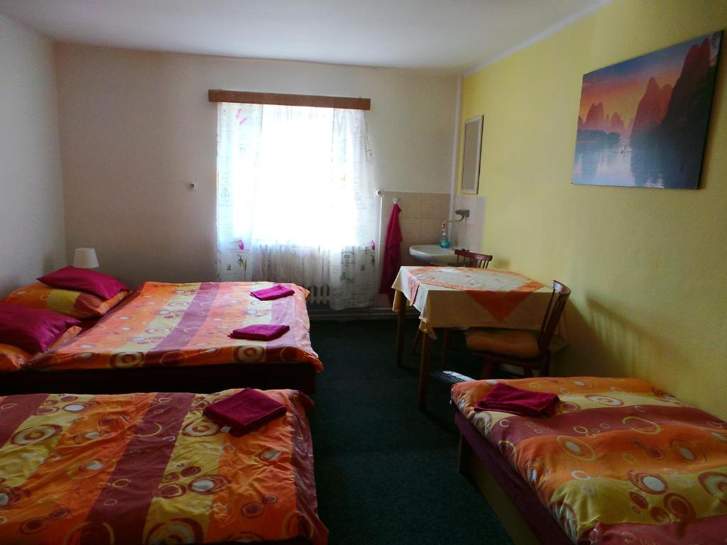 Postel nebo postele na pokoji v ubytování Penzion Tomy Pihlov